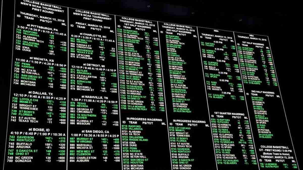 An electronic board displaying a schedule of college basketball games with times and locations, denoting a busy lineup for an ongoing or upcoming sports tournament. horse racing trading